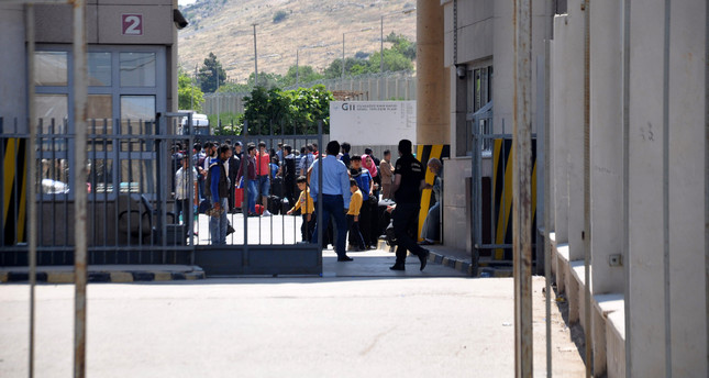 لاجئون سوريون يغادرون تركيا لقضاء رمضان والعيد في وطنهم 