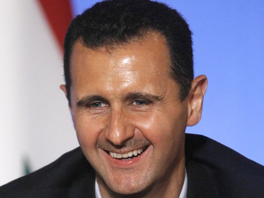 بشار الأسد يضحك