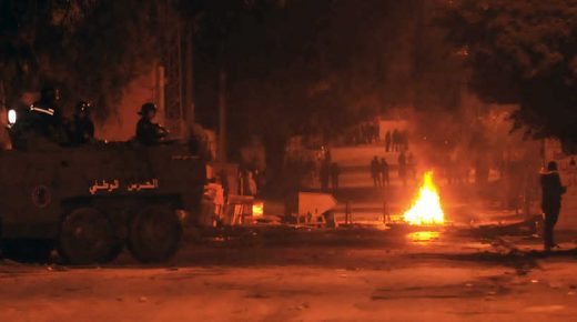 Tunisian protestors throw stones towards security forces in Tunis' Djebel Lahmer district early on January 10, 2018 after price hikes ignited protests in the North African country. - Fresh scuffles broke out overnight night between Tunisian protesters and police, a day after the death of a man in violent demonstrations over rising costs and government austerity. Hundreds of young people took to the streets of Tebourba, west of Tunis, pelting stones at security forces who responded by firing tear gas at them, an AFP journalist said. (Photo by Sofiene HAMDAOUI / AFP)