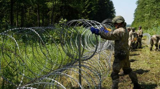 Lithuanian army soldiers install razor wire on border with Belarus in Druskininkai, Lithuania July 9, 2021. REUTERS/Janis Laizans